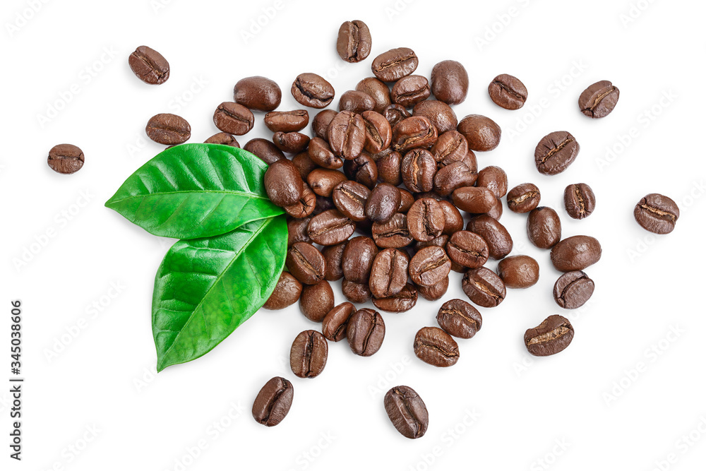 Heap of roasted coffee beans with leaves isolated on white background . Top view. Flat lay. Heap of roasted coffee beans with leaves isolated on white background . Top view. Flat lay.