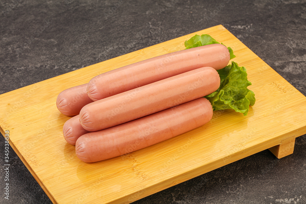 Tasty meat sausages over board Tasty meat sausages over board