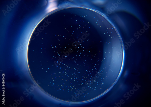 Abstract circle on a dark blue background. Blue hole in the dark.