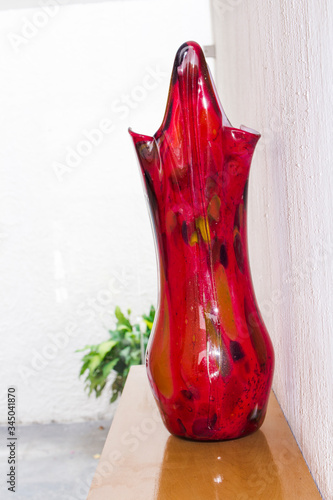 RED vase with PLANTS BACKROUND