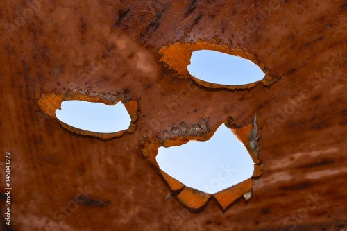 face natural. rusty joke. Holes in the surface