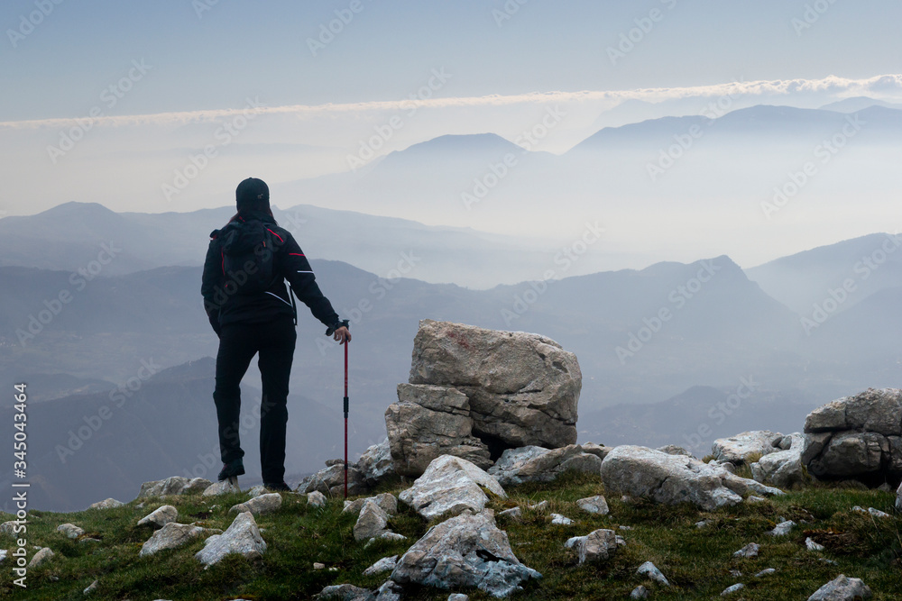 woman hiker on mountain peak