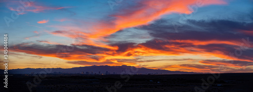 Sunset view of the beautiful strip skyline with red clouds © Kit Leong