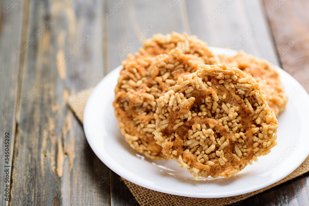 Sweet crispy rice mixed with watermelon juice with cane sugar drizzle, Local Thai snack (Khao Tan Nam Tangmo) Sweet crispy rice mixed with watermelon juice with cane sugar drizzle, Local Thai snack (Khao Tan Nam Tangmo)