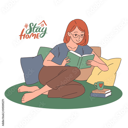Cartoon redhead young woman in glasses sitting on pillows and reading a book. Flat vector illustration with lettering. Stay home, introvert concept for social media, web banner.
