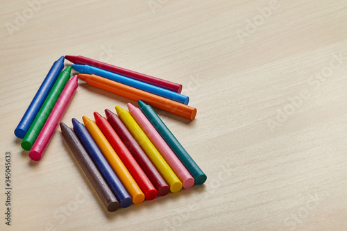 Colorful crayon on wooden table