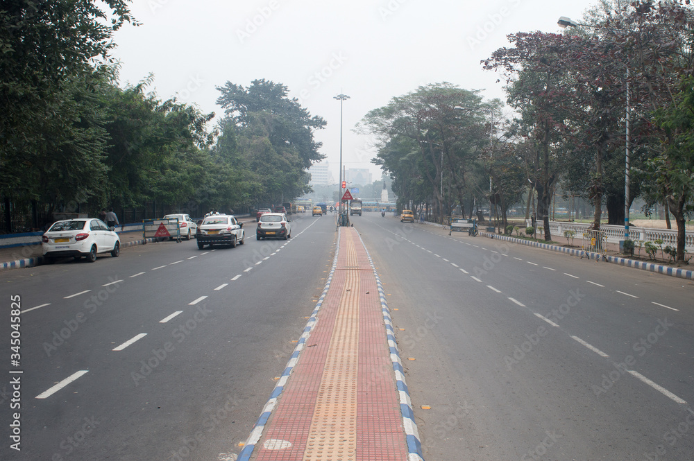 City street landscape in a winter foggy morning. Kolkata India South Asia Pacific February 2020