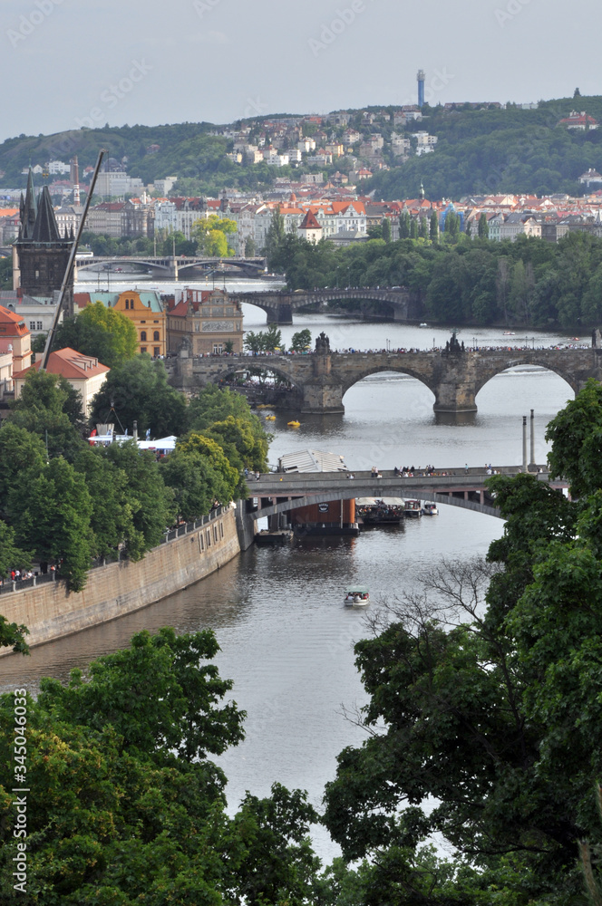 Panorama of numerous bridges over the Vltava River in Prague. A fine summer day in the Czech Republic.