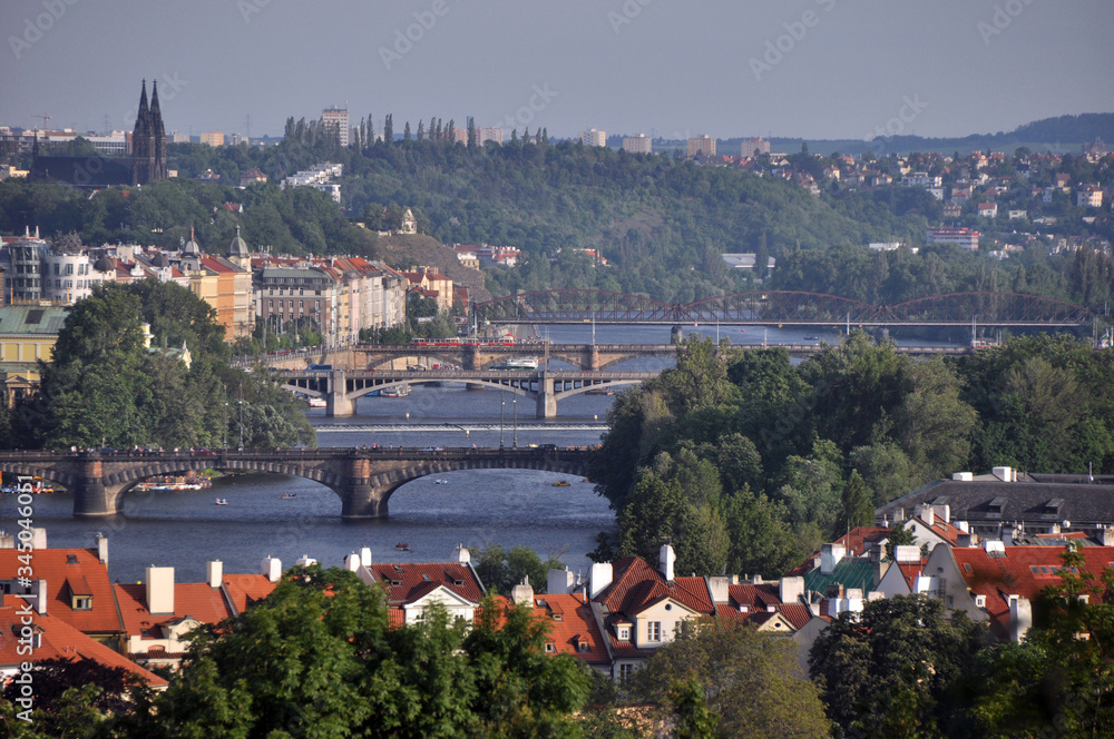 Panorama of numerous bridges over the Vltava River in Prague. A fine summer day in the Czech Republic.