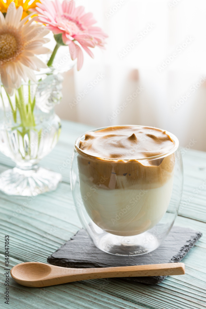 Whipped dalgona coffee on a wood background - ダルゴナコーヒー Whipped dalgona coffee on a wood background - ダルゴナコーヒー
