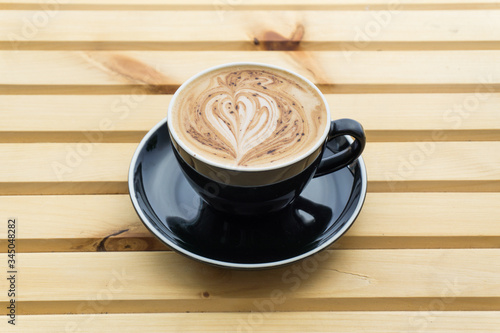 Hot Chocolatein a cup on a wooden background, product photography