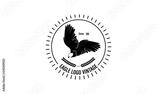 vintage-style emblem logo with an eagle theme photo