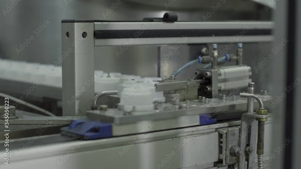 plastic bottles on Medical Solutions Conveyor . Blow fill seal technology technique used to produce liquid-filled container on medical or food industrial factory. medical industry plastic bottles on Medical Solutions Conveyor . Blow fill seal technology technique used to produce liquid-filled container on medical or food industrial factory. medical industry