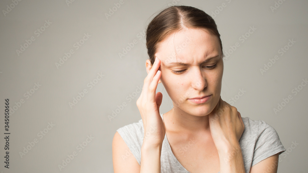 Headache And Stress. Beautiful Young Woman Feeling Strong Head Pain. Portrait Of Tired Stressed Female Suffering From Painful Migraine, Holding Hands Near Face. Health Care Concept. High Resolution