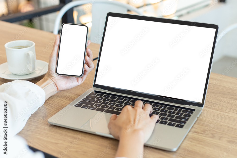 computer,cell phone mockup image blank screen with white background for advertising,hand woman work using laptop texting mobile contact business search information on desk in cafe.marketing,design computer,cell phone mockup image blank screen with white background for advertising,hand woman work using laptop texting mobile contact business search information on desk in cafe.marketing,design