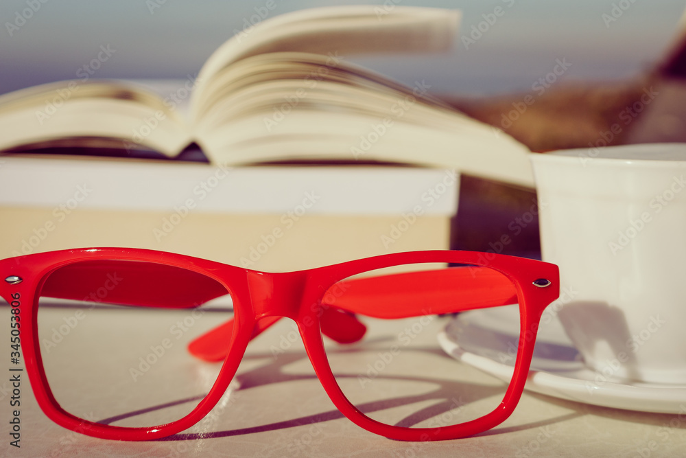 Coffee cup and book outdoor