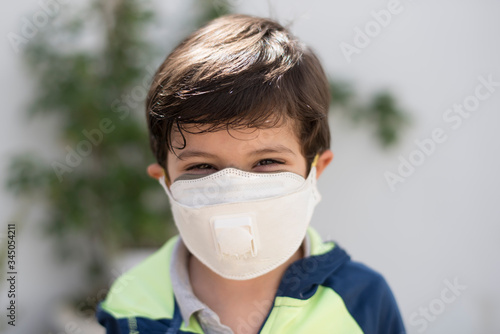 four years old boy with facial mask portrait