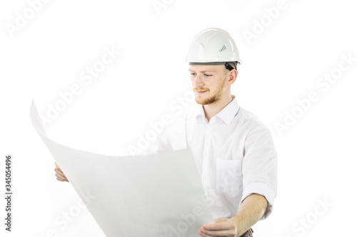 Satisfied handsome engineer in safety helmet working with blueprint documents isolated on white background. Successful man from industrial sphere, building sector, construction industry photo