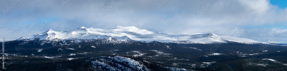 Winter landscape with dramatic snowy mountains. Panorama