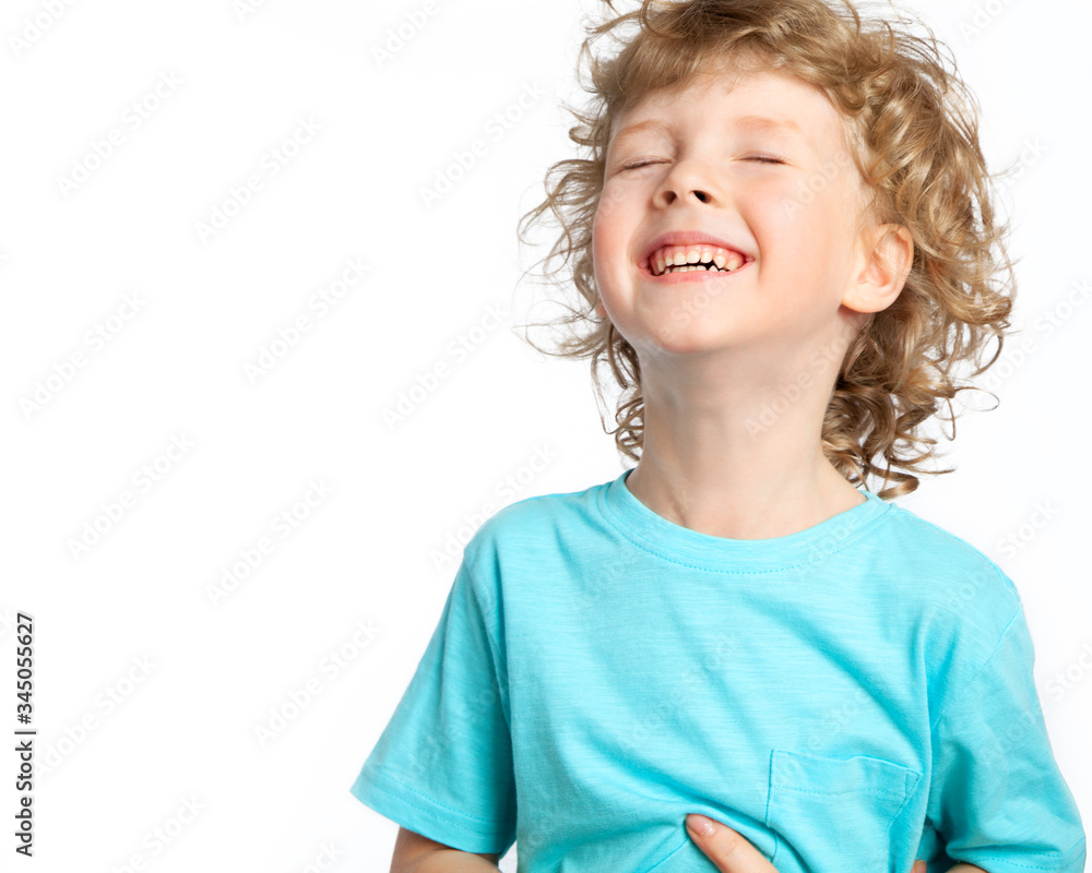 Hunor Child A happy child bursts out laughing, holding his stomach with laughter ...