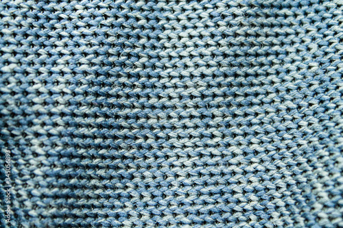 Embroidered fabric texture in blue. 