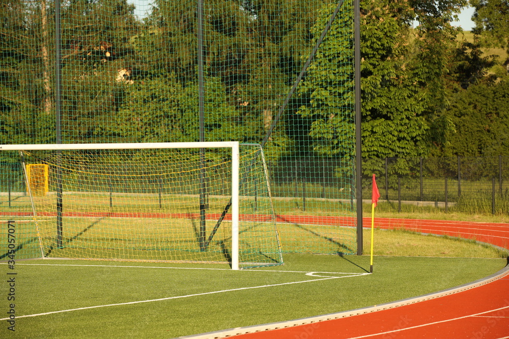 Fototapeta premium Jaslo, Poland - 7 9 2019: Goal on a football field with natural green grass in the open stadium of the city. A place for competitions and sporting events. Landscaping sports. Outdoor activities