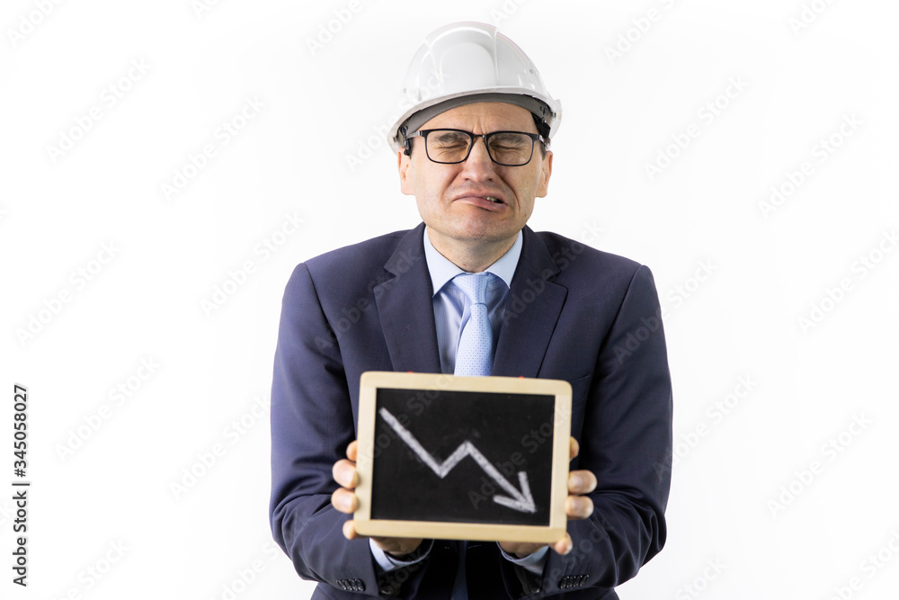 Crying mining engineer in hard hat holds tablet with down arrow declining oil quotes. Oil refinery industry, stock drop, quotes reduction, collapse of oil market, reduction in oil production concept Crying mining engineer in hard hat holds tablet with down arrow declining oil quotes. Oil refinery industry, stock drop, quotes reduction, collapse of oil market, reduction in oil production concept