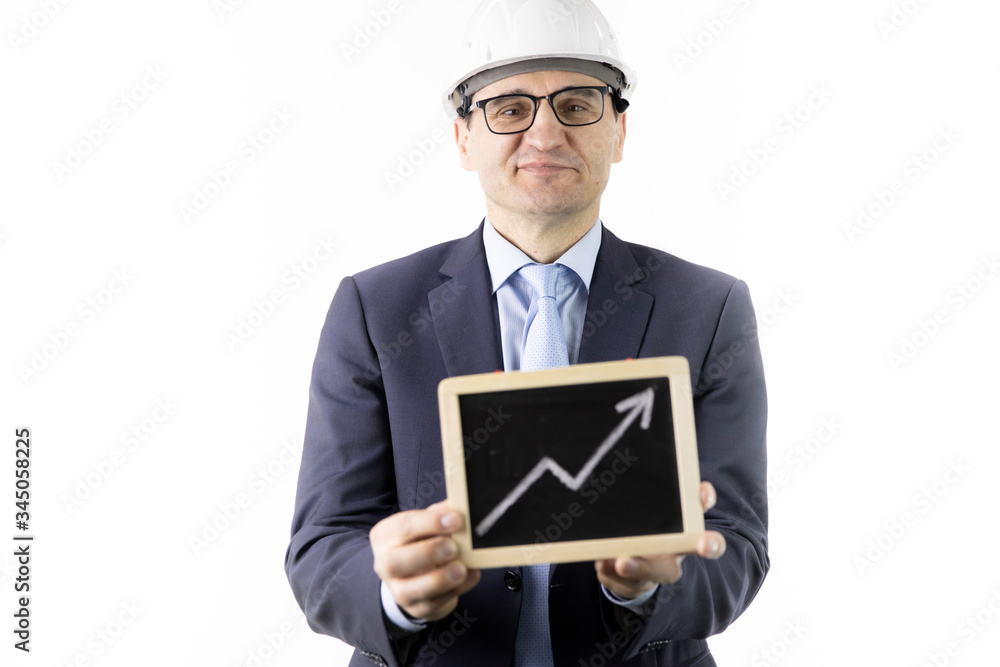 Happy mining engineer holding sign with up arrow rising oil quotes. Oil refinery industry, market strengthening, growth of quotes, sales and supply growth concept Happy mining engineer holding sign with up arrow rising oil quotes. Oil refinery industry, market strengthening, growth of quotes, sales and supply growth concept