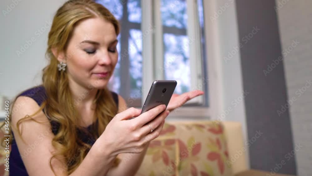 Young woman having a video call through a tablet, talking to mom. friends, facetime, online, internet, long distance communication, chat concepts. Skype talking with grandma Young woman having a video call through a tablet, talking to mom. friends, facetime, online, internet, long distance communication, chat concepts. Skype talking with grandma