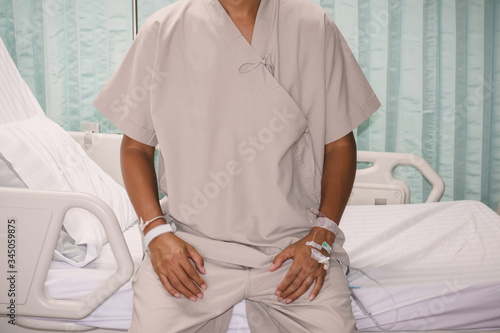 Male patient  on patient bed in hospital
