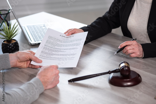 Female lawyer showing a document to her client