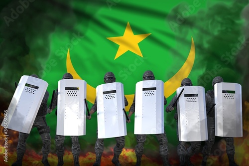 Billede på lærred Mauritania protest stopping concept, police squad in heavy smoke and fire protec
