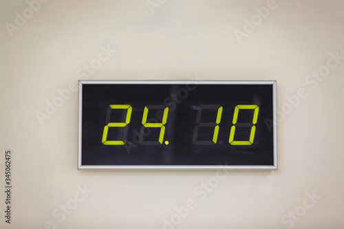 Black digital clock on a white background showing time 24:10