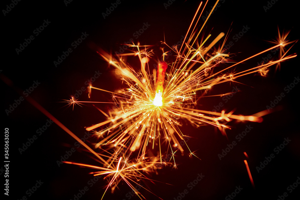 Sparkler background. Christmas and new year sparkler holiday background.. Sparkler background. Christmas and new year sparkler holiday background..