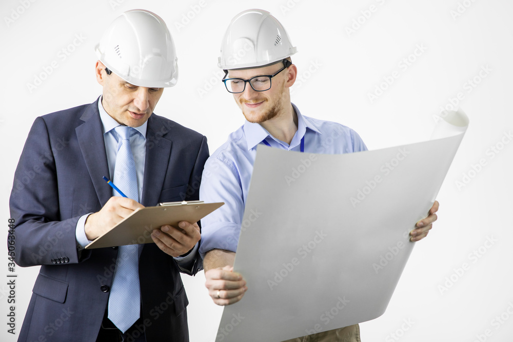Architectural engineers working with blueprint marking edits in documents on clipboard isolated on white background. Meeting, discussing, designing, planing concept. BIM, Industry construction Architectural engineers working with blueprint marking edits in documents on clipboard isolated on white background. Meeting, discussing, designing, planing concept. BIM, Industry construction