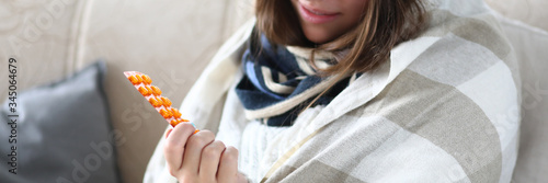 Close-up of smiling woman on sick leave at home. Experienced doctor prescribing treatment and medication for ill patient. Seasonal sickness and medicine concept