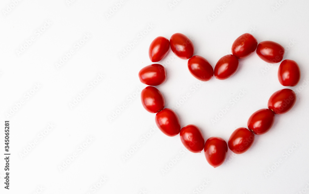 Heart shaped tomatoes on a white background Heart shaped tomatoes on a white background