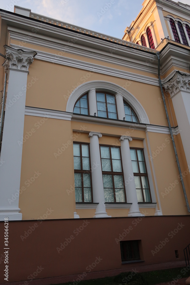 Fototapeta premium large dark windows of a light building