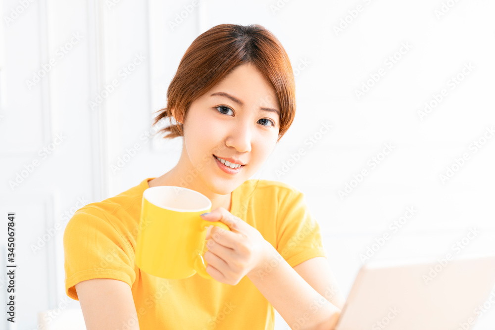 smiling young Woman working on laptop at home smiling young Woman working on laptop at home