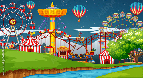 Scene with many rides in the funpark at night