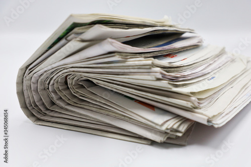 Pile of newspapers stacks on blur background 
