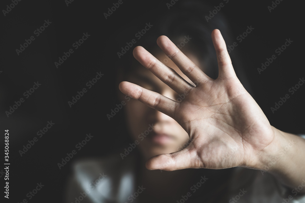 Fototapeta premium woman raised her hand for dissuade, campaign stop violence against women, including rape and human trafficking.