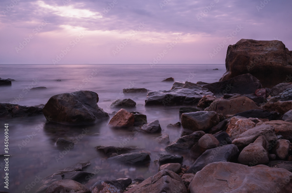 beautiful purple sunset on the sea coast