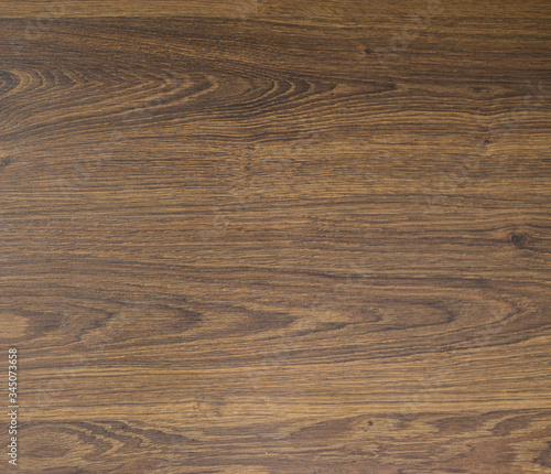 Wooden brown textured floor or desk background and texture of Walnut wood decorative furniture surface