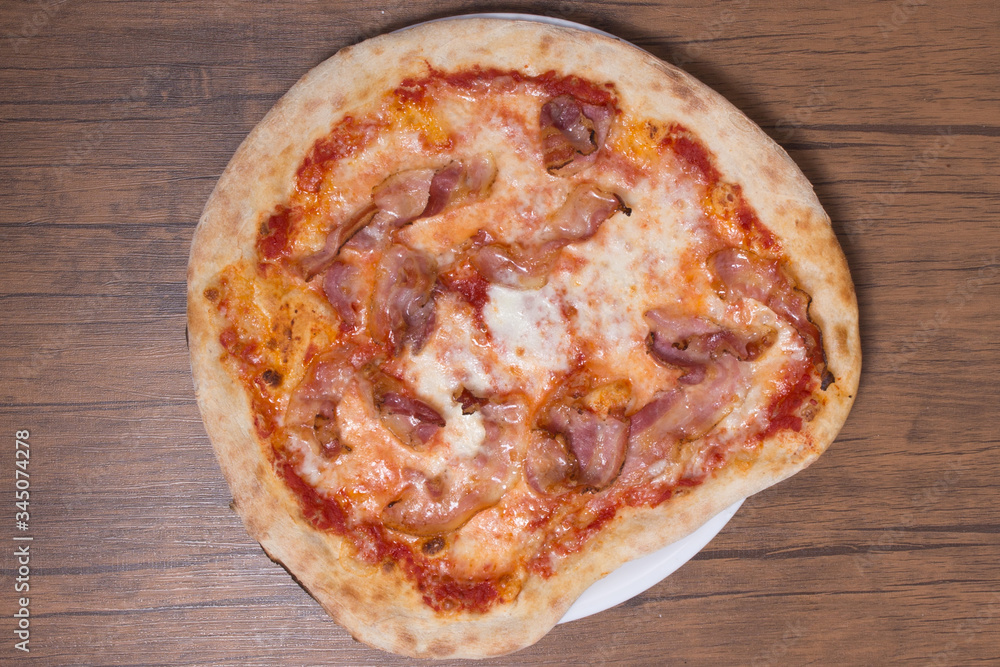 Pizza margherita with parma ham and rocket. Pizza margherita with parma ham and rocket.