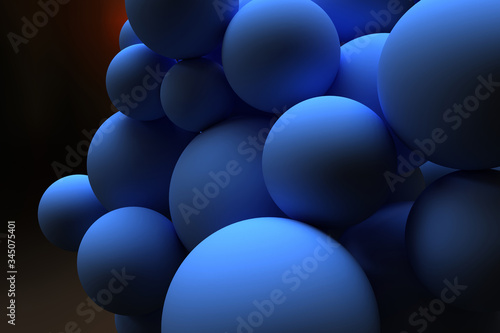Blue balls of different sizes on a dark background