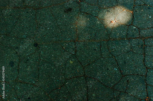 Black asphalt with cracks. Old asphalt road with texture. Dark abstract background. photo