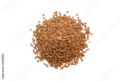 Buckwheat isolated on white background. Top view. Heap of raw buckwheat grains 