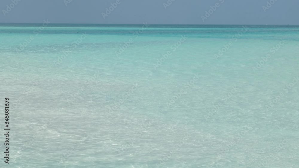Ocean or Sea with Sparkling Light Reflections on Surface. Turquoise Water in Sunny Day. Faraway Frame. Ocean or Sea with Sparkling Light Reflections on Surface. Turquoise Water in Sunny Day. Faraway Frame.