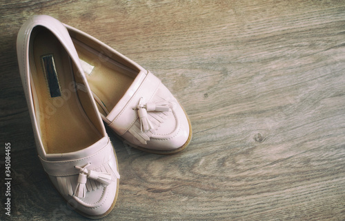 Loafers shoes retro style stand on the wooden floor.
